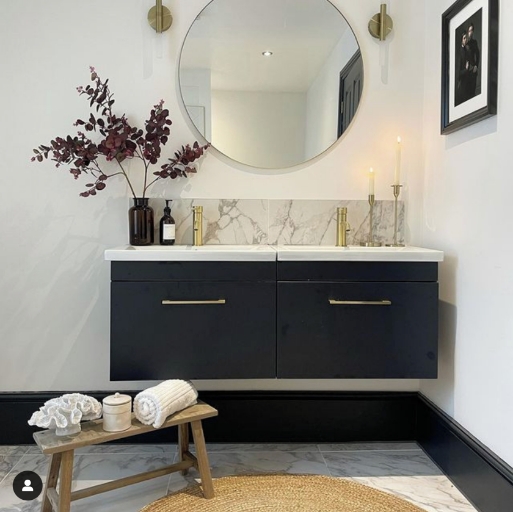 Athena wall hung furniture with contemporary brass handles, in a modern bathroom