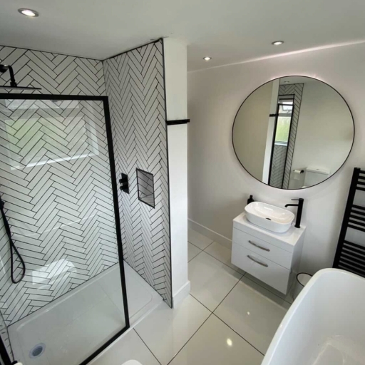 Black framed wetroom screen and a vanity unit with a vessel